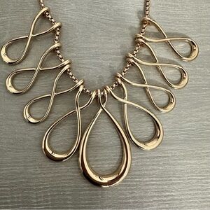 Erica Lyons shiny, gold toned, Infinity design bib necklace, statement piece.